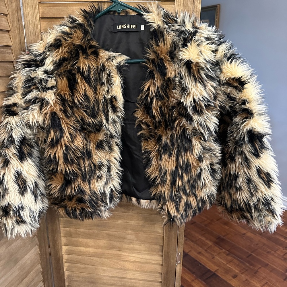 Cute, playful, faux fur girls jacket size 7/8. Like new condition. Smoke free